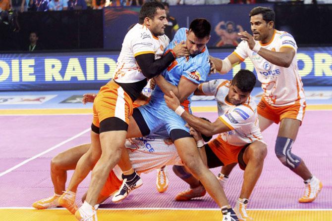 Puneri Paltan and Bengal Warriors players in action during the Pro Kabaddi league match in Ahmedabad on Tuesday. Pic/PTI