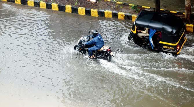 The accumulated water due to the rains in the commercial district did not recede for more than 12 hours. Pic/Nimesh Dave