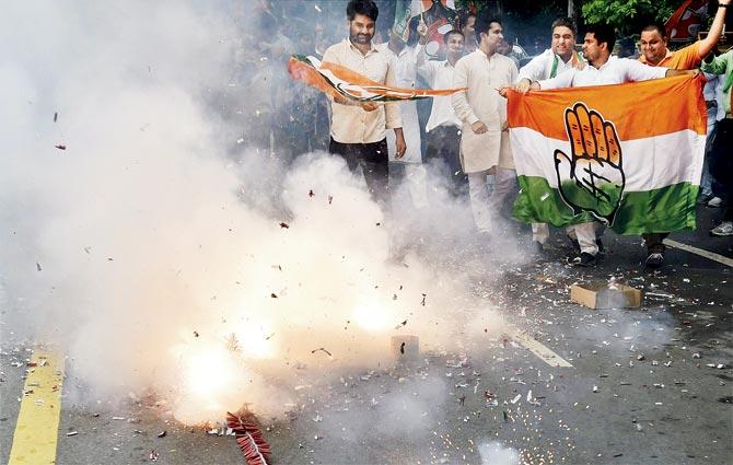 Youth Congress activists burst fire-crackers to celebrate Ahmed Patel