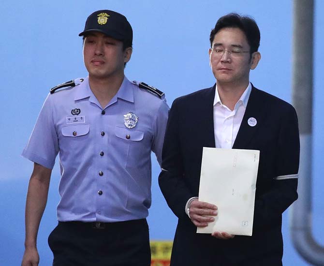 Samsung Group heir Lee Jae-yong leaves the Seoul Central District Court following his verdict in Seoul. Pic/AFP