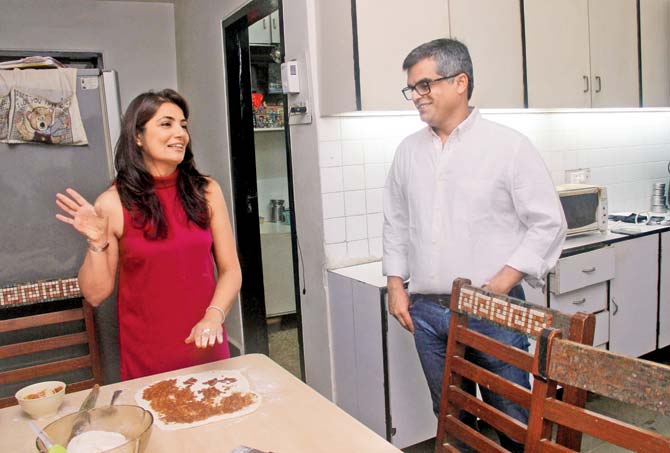 Atul looks on as Shaguna bakes in the kitchen
