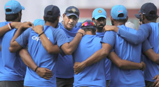 Indian cricket team coach Ravi Shastri, center facing camera, speaks to players before the beginning of the fourth day of the first test cricket match between India and Sri Lanka in Galle, Sri Lanka, Saturday, July 29, 2017. Pic/AP/PTI