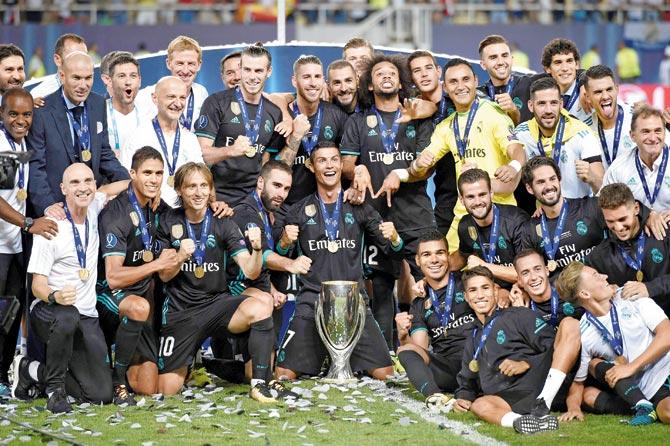 The Real Madrid team with their UEFA Super Cup after defeating Manchester United in Macedonia on Tuesday. Pic/AFP