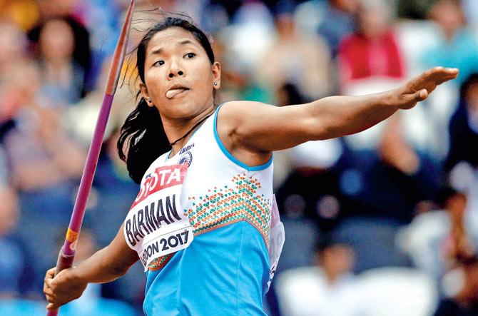 Swapna makes an attempt with a javelin during the heptathlon event on Sunday. Pic/AP, PTI