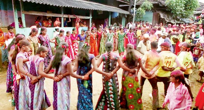 Villagers perform the tribal dance in a circle