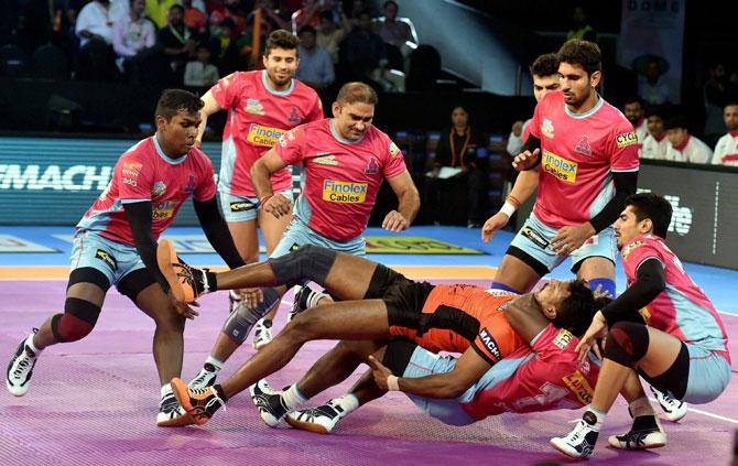 U Mumba (orange) and Jaipur Pink Panthers (Pink) players in action during their Pro Kabaddi League match in Mumbai on Friday. Pic/PTI