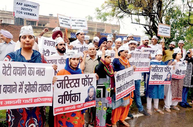 Activists display placards during a protest over the Varnika Kundu stalking case in Chandigarh on Wednesday. The two accused were arrested on Thursday. Pic/PTI