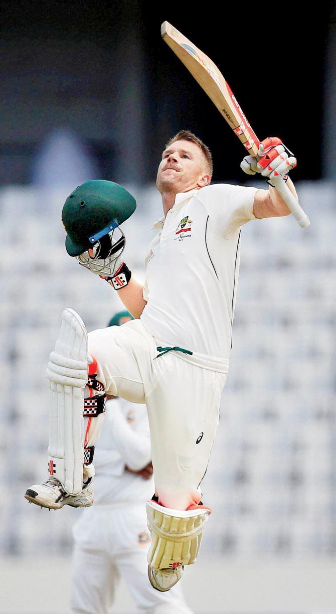 Warner celebrates after scoring a ton. Pics/AP,PTI