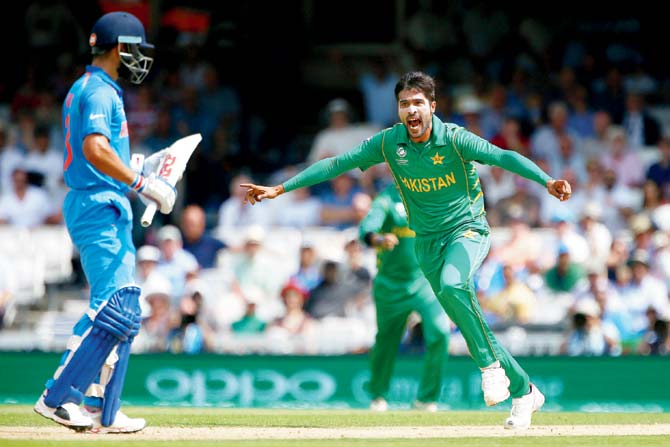 Pakistan’s Mohammad Amir celebrates in style after dismissing India skipper and key batsman Virat Kohli in the ICC Champions Trophy final at The Oval on June 18, 2017 in London. Pakistan ended up beating India by 180 runs. Pic /Getty Images