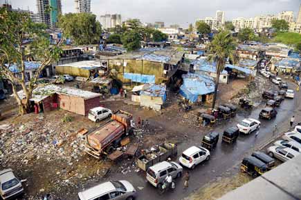 Mumbai: 200-m Andheri road riddled with potholes, garbage and encroachments
