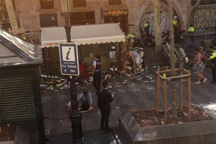 Van crashes into dozens of people in Barcelona, 2 killed, several injured