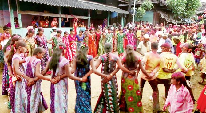 Villagers perform the tribal dance in a circle