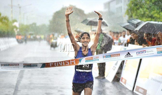 Varsha Bhavari celebrates after winning the Mumbai half marathon yesterday. Pic/Shadab Khan