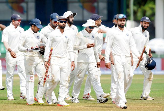 Skipper Virat Kohli leads Team India out of the ground after their victory in the second Test against  Sri Lanka at the Sinhalese Sports Club ground in Colombo recently. Pic/AFP