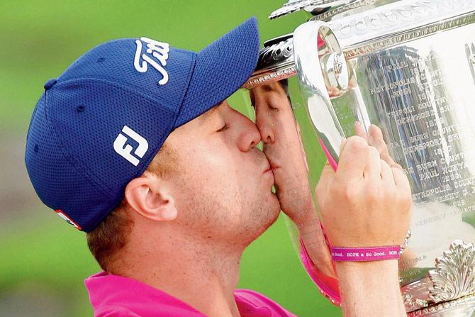 US golfer Justin Thomas kisses the Wanamaker Trophy after winning the 99th PGA Championship in Charlotte, US on Sunday. Pic/Getty Images
