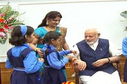 Vrindavan widows, students tie 'rakhi' on PM Narendra Modi's wrist on 'Raksha Bandhan'