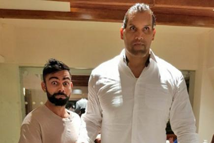 Kohli meets Khali! Virat's photos with WWE star makes Twitter go crazy