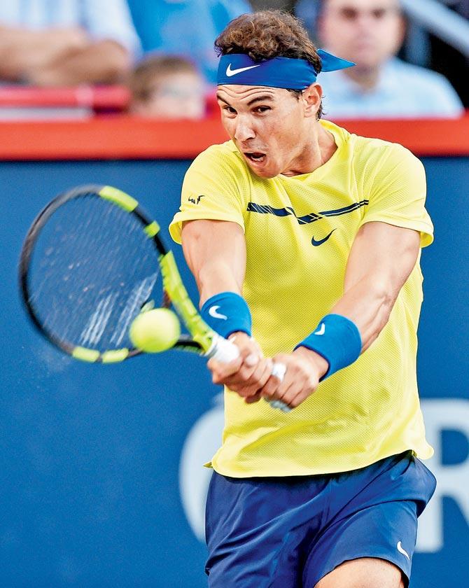 Rafael Nadal returns to Borna Coric at the Rogers Cup in Montreal yesterday. Pic/AFP