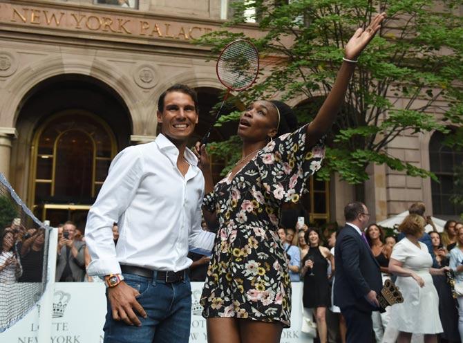Venus Williams of the USA poses with world number one tennis player Rafael Nadal of Spain following their match in the Lotte New York Palace