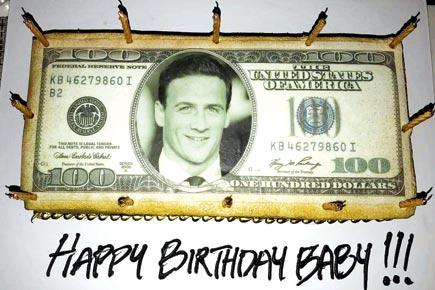 Swimmer Ryan Lochte's birthday cake has his face on a USD 100 note