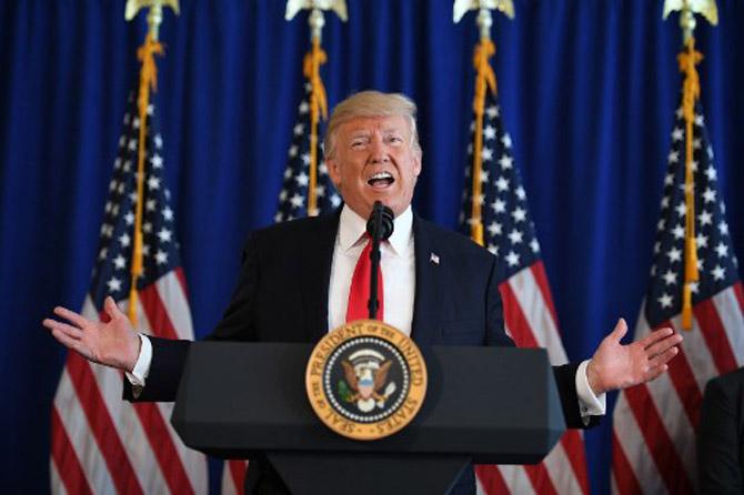 US President Donald Trump speaks to the press about protests in Charlottesville on August 12, 2017, at Trump National Golf Club in Bedminster, New Jersey. A picturesque Virginia city braced Saturday for a flood of white nationalist demonstrators as well as counter-protesters, declaring a local emergency as law enforcement attempted to quell early violent clashes.