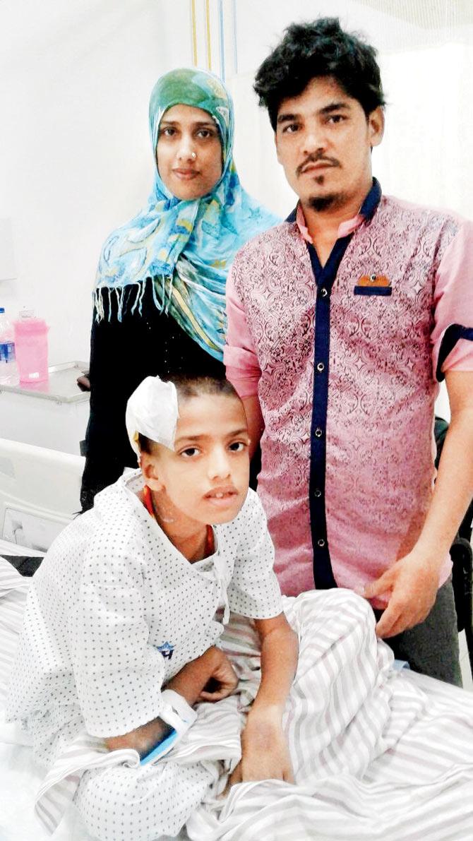 Abdul with his parents Imran and Rubina at the NH SRCC hospital, where he is recovering