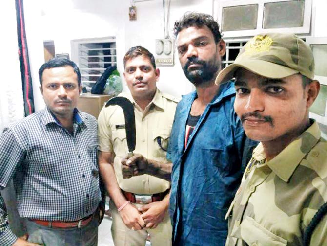 Ajay Pawar (with sickle in hand) was caught late Sunday evening at Byculla station
