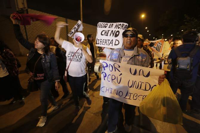 People celebrate in favor of Peru