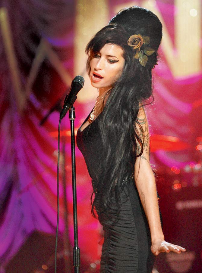 Amy Winehouse performs at London’s Riverside Studios for the 50th Grammy Awards ceremony via video link in 2008. Pic/Getty Images