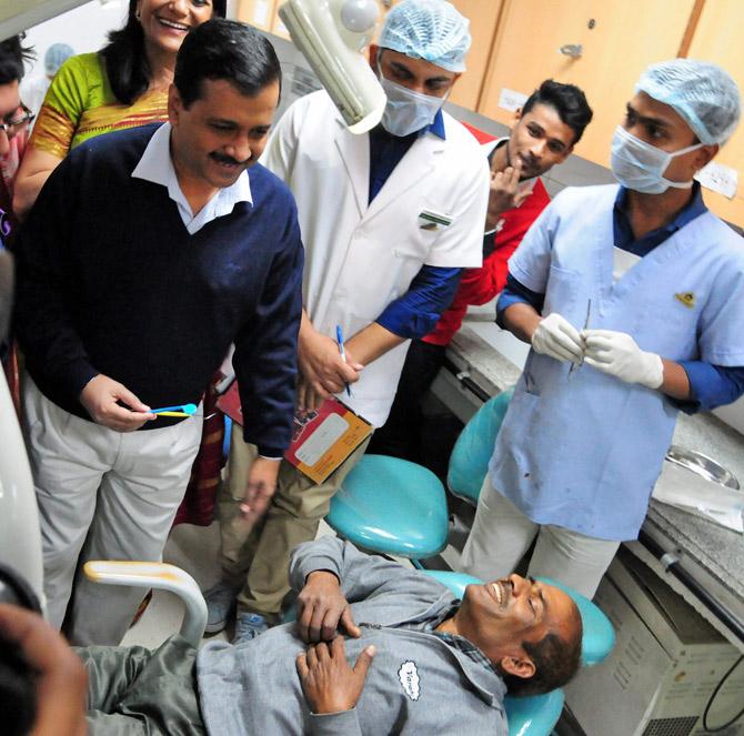 Delhi Chief Minister Arvind Kejriwal interacts with a patient during the first day of Delhi Smiles - Dental Health Utsav 2017 in New Delhi on Tuesday. Pic/PTI