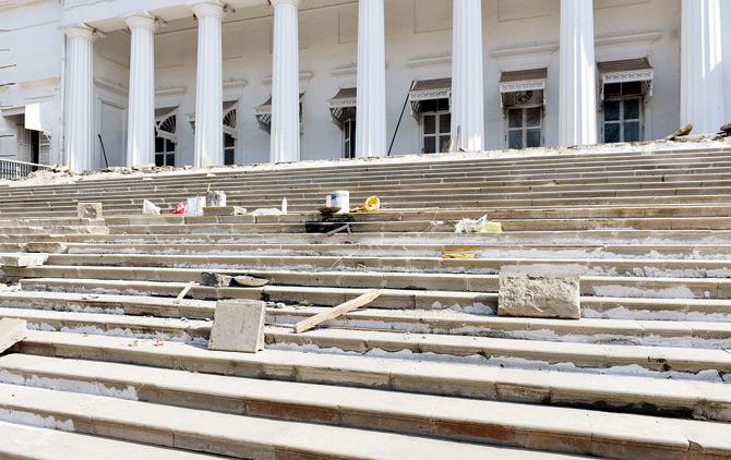 Now: Debris and construction material piled up on the steps for the ongoing work