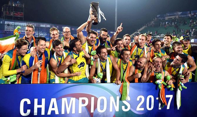 Australian players celebrate with winning trophy after beating Argentina in the final match at the Men