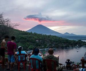 Bali volcano emits wispy plume of steam, flights resume