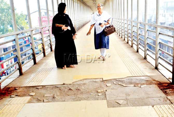 The skywalks in Bandra East and West both face the same problems - beggars, filth and damaged flooring among others. Pics/Datta Kumbhar