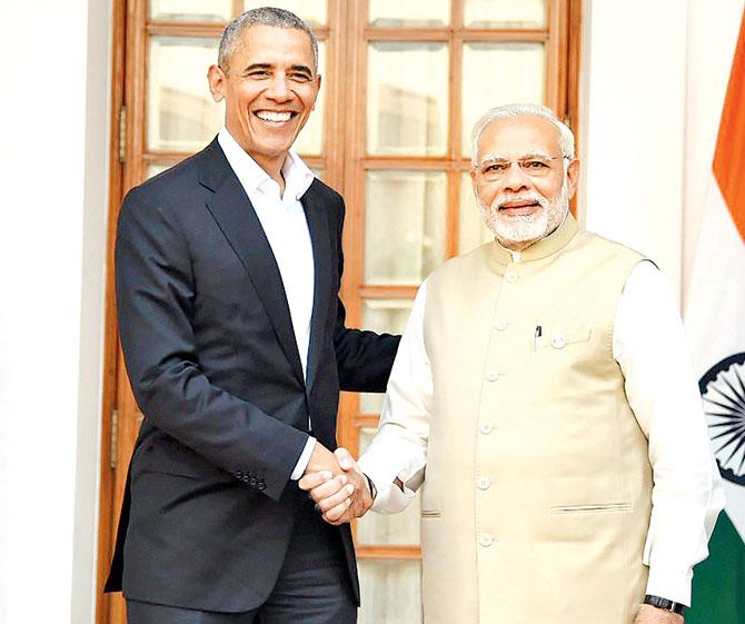 Prime Minister Narendra Modi meets former US President Barack Obama. Pic/PTI