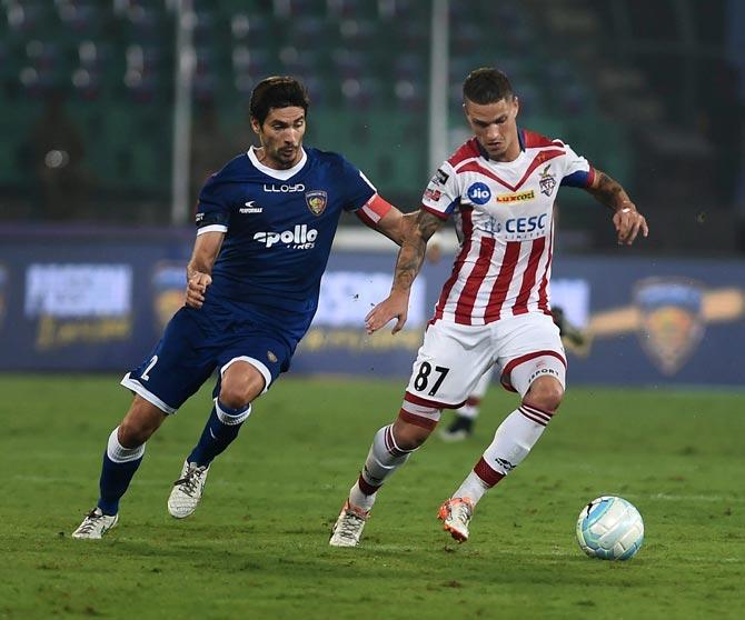 Players of Chennaiyin FC and ATK vie for the ball during ISL Match at Nehru Stadium in Chennai on Thursday. PTI Photo