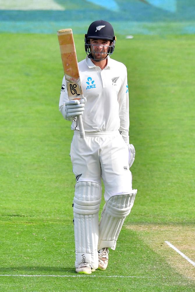 New Zealands Tom Blunder celebrates 50 runs during day two of the first Test cricket match between New Zealand and the West Indies at the Basin Reserve in Wellington on December 2, 2017. / AFP 