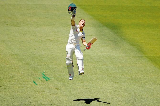 Australias David Warner celebrates his century on Day One of the Melbourne Test against England yesterday. Australia have won the first three Tests of this season’s Ashes series. PICs/GETTY IMAGES