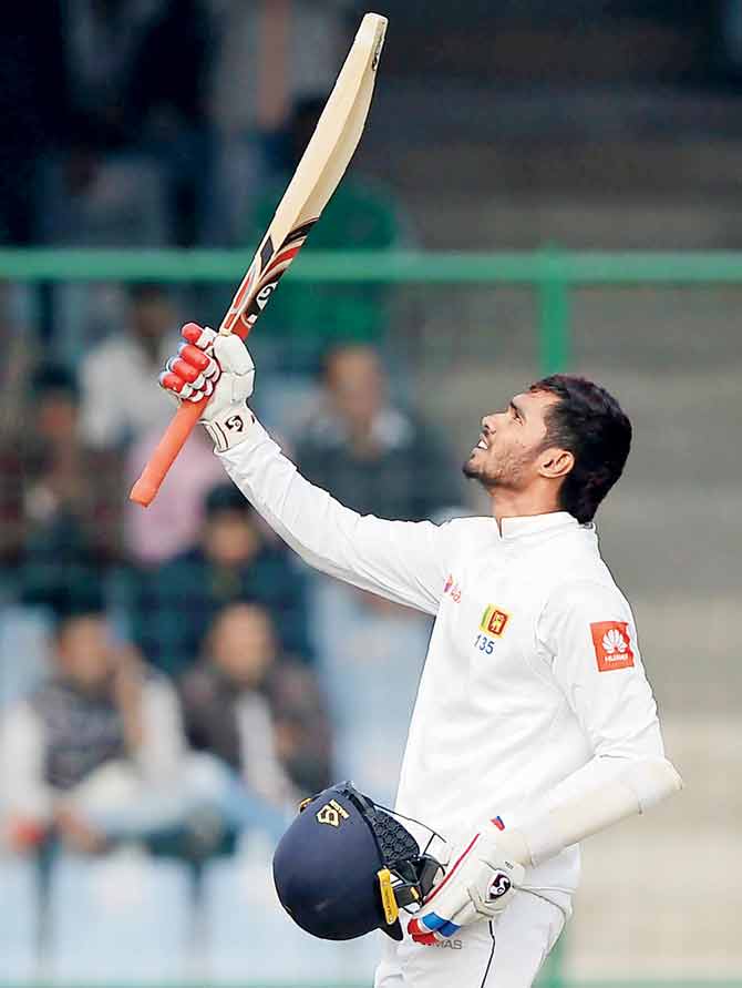  Sri Lanka batsman Dhananjaya De Silva celebrates his century during the fifth day of third Test against India at the Kotla yesterday. PIC/AFP