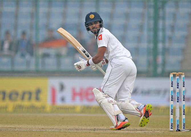 Sri Lanka batsman and team captain Dinesh Chandimal plays a shot during the fourth day of third Test cricket match between India and Sri Lankr at the Feroz Shah Kotla Cricket Stadium in New Delhi on December 5, 2017. Pic/ AFP
