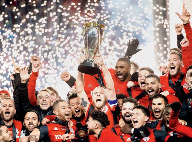 Toronto FC captain Michael Bradley holds up the MLS Cup after his team’s 2-0 win over Seattle Sounders on Saturday. pic/ AP/PTI