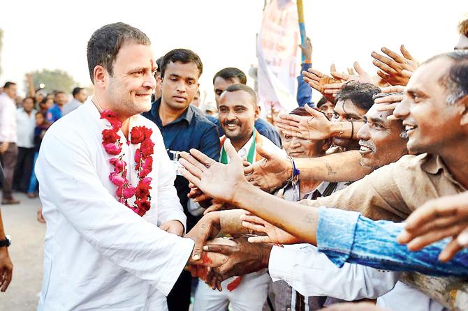 Congress vice-president Rahul Gandhi is greeted by supporters at a rally in Bhavnagar, Gujarat on Thursday. Pic/PTI