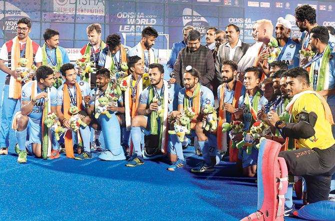 Indian players pose with their bronze medals after beating Germany in the third-place match yesterday. Pic/AFP
