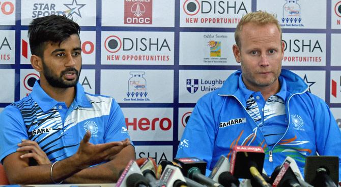 Indian Hockey captain Manpreet Singh(L) and coach Sjoerd Marijne(R) attend a press conference on the eve of their match against Australia at Men