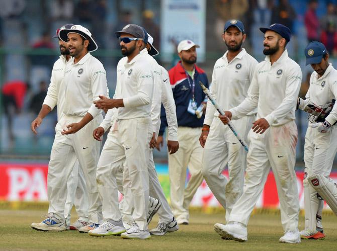 Indian team members walk off the filed after the end of the third cricket test match against Sri Lanka, at Ferozshah Kotla in New Delhi on Wednesday. The Test ended in draw and India won the series 1-0. Pic/PTI