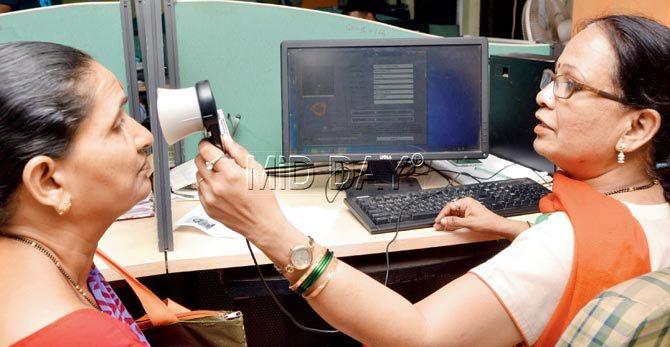 Jaywantibai Wakale gets her iris scanned at the Regional Employees
