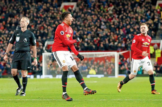  Man Uniteds Jesse Lingard (centre) celebrates the second goal with Luke Shaw during their EPL match against Burnley yesterday. Pic/AFP