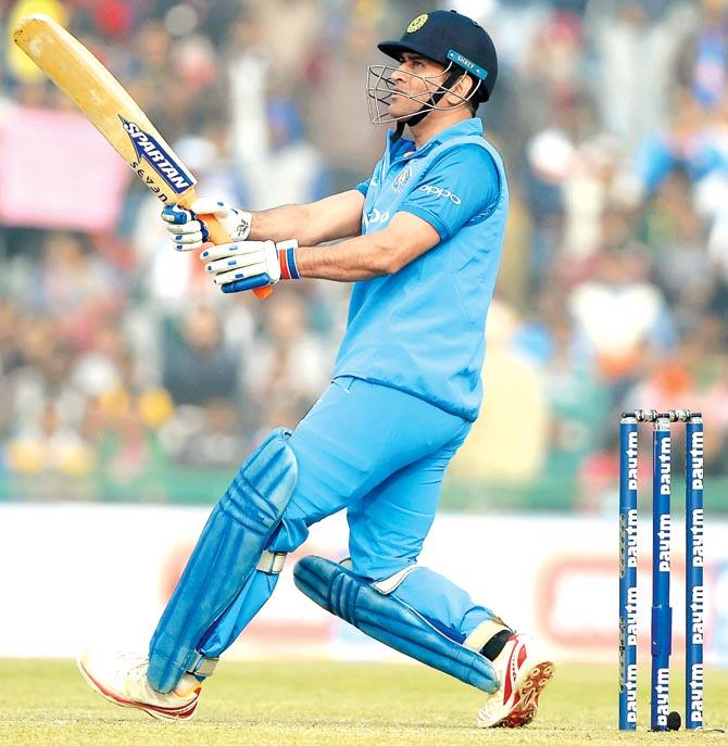 MS Dhoni hits out in the second ODI against Sri Lanka at Mohali on Wednesday. Pics/AFP