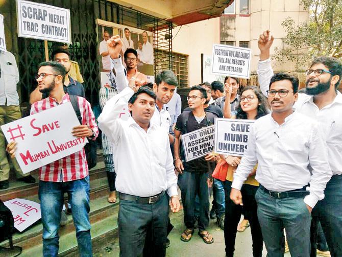 A group of law students stage a protest outside the exam section of MU on Thursday