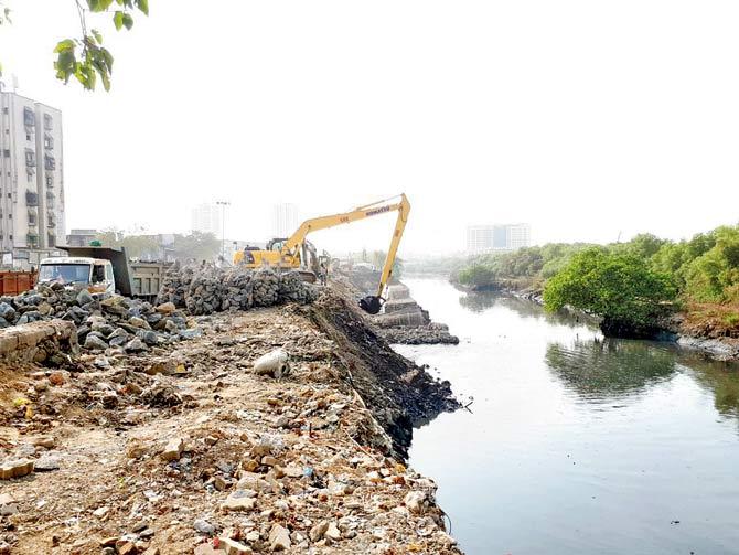 Workers dump muck into Mithi river during Metro III work, almost halving the river